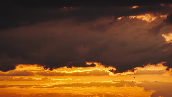 Amazing Sunset Through the Layers Clouds in the Orange Sky Majestic Timelapse