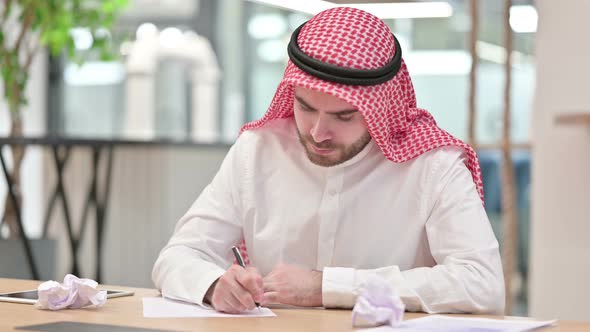Arab Businessman Having Failure Writing on Paper in Office 