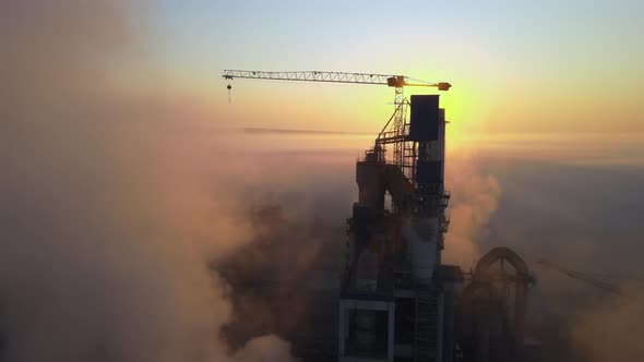 Aerial View of Cement Factory with High Concrete Plant Structure and Tower Crane at Industrial