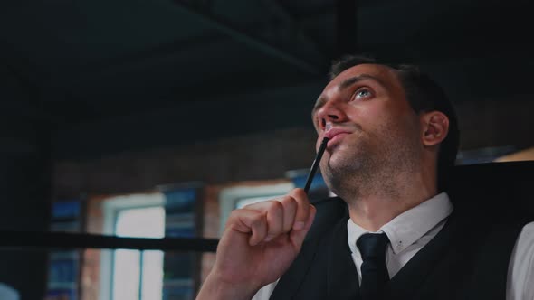 Male Architect Working Thinking in the Office on a Residential Building Project