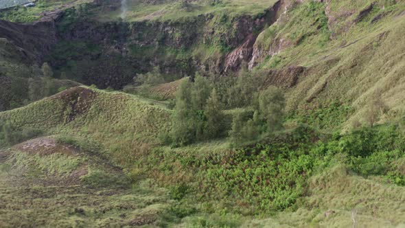 Aerial View. Mountain and Green Valley View. Traveling Woman Enjoying Mountain Landscape.