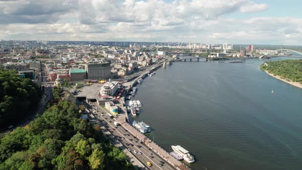 Aerial View of Metropolis By River with Skyscrapers Highway and Car Traffic