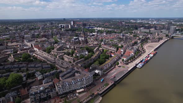 Aerial sideways rotating pan cityscape of Dutch historic Hanseatic city center of Nijmegen in The Ne