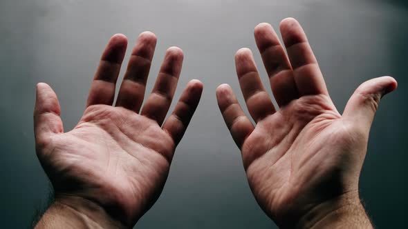 Male Hands on Grey Background Man Showing Palms and Fingers Closeup Human Skin Texture