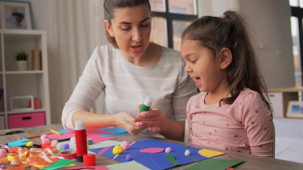 Daughter with Mother Making Applique at Home