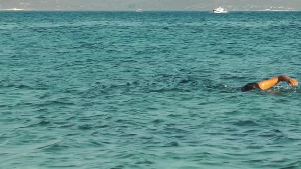 Beach And Floating Boat