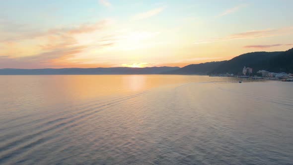 Aerial Footage of Flight Over the Sea at Sunset