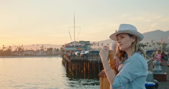 Portrait of Attractive Woman Enjoying Beautiful Golden Sunset Over the Water, 