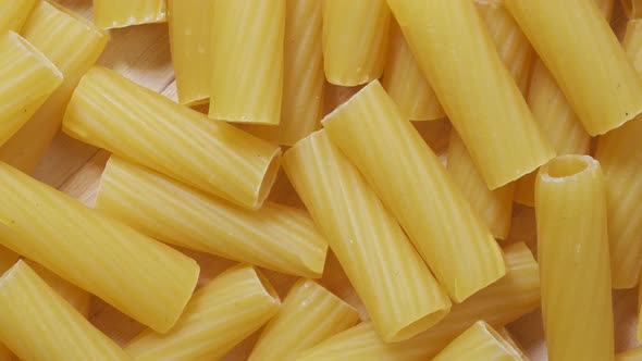 Close-up of Raw Penne Pasta, Texture or Background, Italian Design.