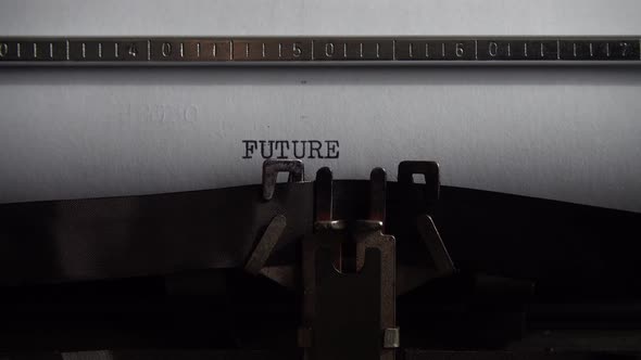 Typing word Future on an old typewriter. Close up.