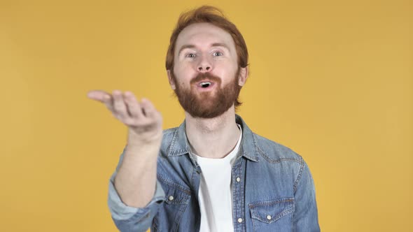 Flying Kiss By Redhead Man, Yellow Background