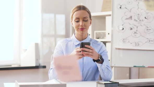 Businesswoman with Smartphone and Smart Watch