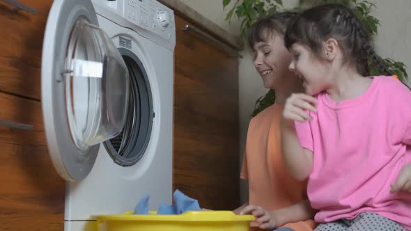 Children wash clothes.