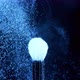 Blue Neon Glowing Ultraviolet Powder on a Makeup Brush Flying Away with Beautiful Vintage Bokeh - VideoHive Item for Sale
