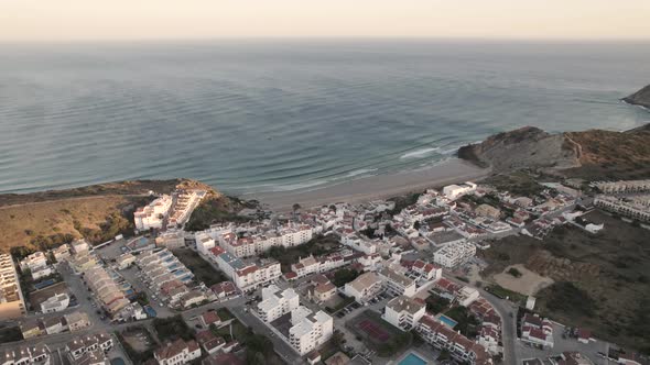 Quiet Burgau beach in Portugal without people during golden hour