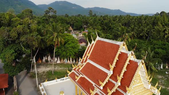 Classic Buddhist Temple Between Forest. From Above Drone View Buddhist Monastery Between Green Trees