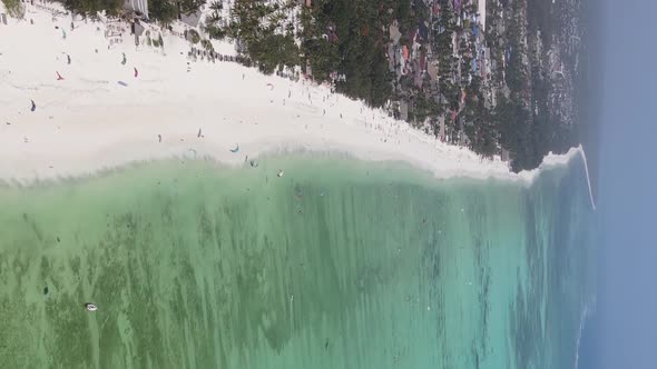 Vertical Video Boats in the Ocean Near the Coast of Zanzibar Tanzania Aerial View