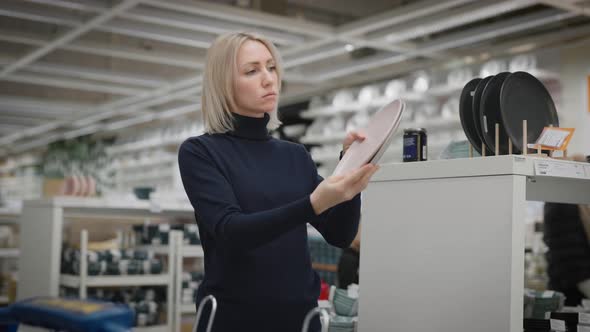 Young Woman in a Kitchenware Shop