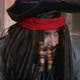 Pirate in a Tricorn Hat and in a Wig with Dreadlocks Decorated with Beads Looks Around Making Sure - VideoHive Item for Sale