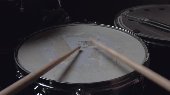 the Drummer Plays with Sticks on a Snare Drum, Home Lesson Training.