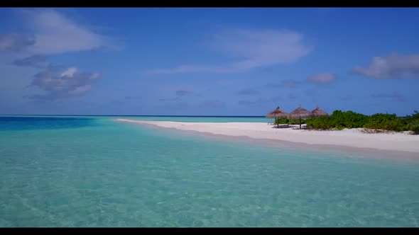 Aerial top view scenery of luxury resort beach wildlife by turquoise water and white sandy backgroun