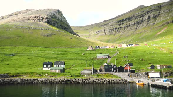 Ferry Arriving to the Port in Sydradalur