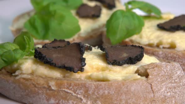 Slices of Black Truffle Fall on Cheese Bruschetta