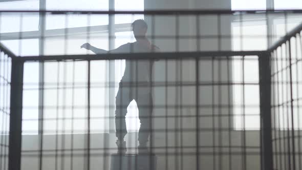 Skillful Street Dancer Hip-hop Dancing on a Barrel in an Abandoned Building