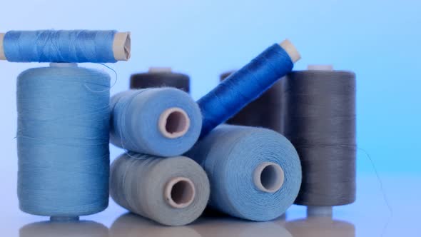 Sewing threads set.Blue and gray thread spools