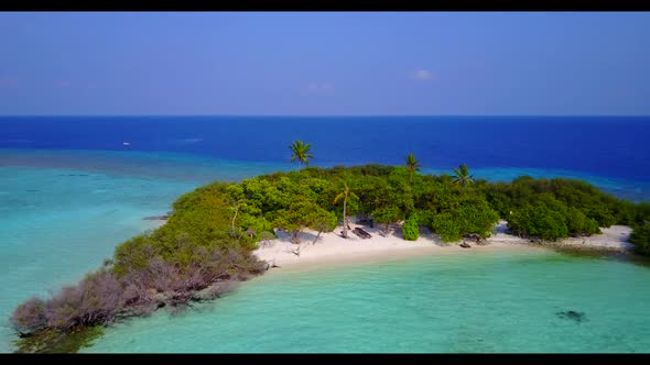 Aerial drone shot landscape of tropical resort beach adventure by transparent ocean and bright sand 