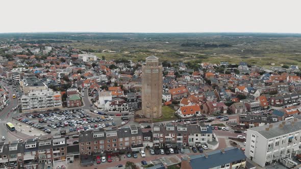 Aerial drone footage of a water tower and the surrounding city of Zandoort, Netherlands.