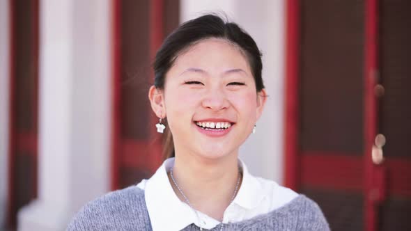 Close Up Portrait of Happy Asian Girl Looking at Camera