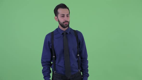 Stressed Young Bearded Persian Businessman Looking Around and Feeling Upset