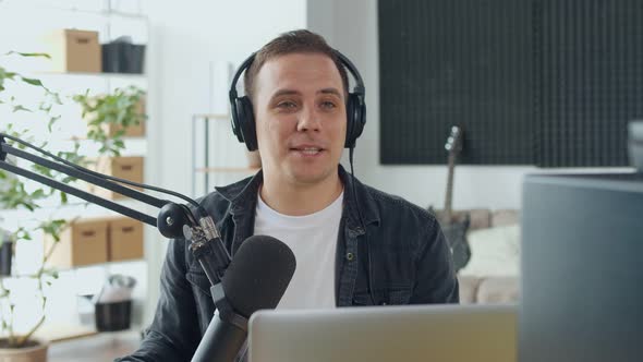 Male Presenter Creates Audio Content Records a Podcast or Radio Show