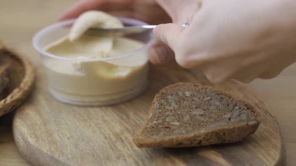 Spreading Vegan Butter On Rye Bread