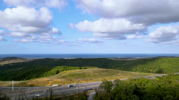 Drone flight over the north Istanbul forest. Cloudy sky, blue sea and green nature