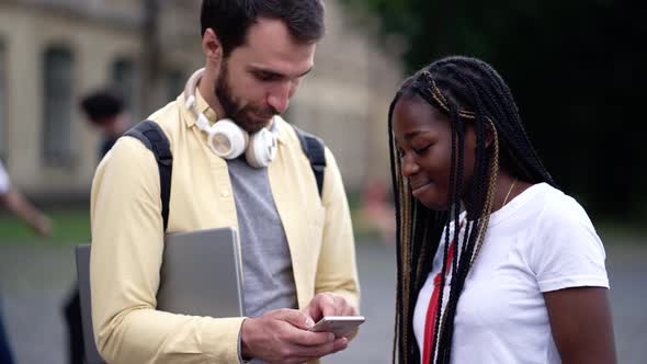 Joyful Diverse Classmates Communicating Outdoors