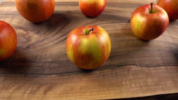 Ripe apples on a wooden board