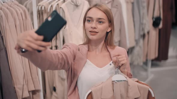 Happy Woman Taking Selfie while Shopping