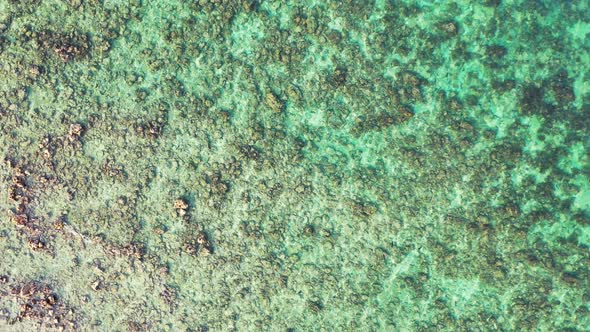 tropical sea water ocean texture, Jamaica coral reef system. Aerial vertical background