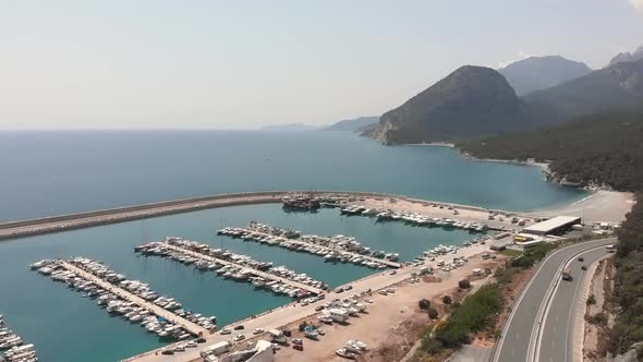 Sea harbour with boats and white yachts