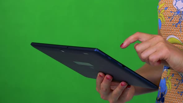 Young Woman Works on Tablet - Green Screen - Studio