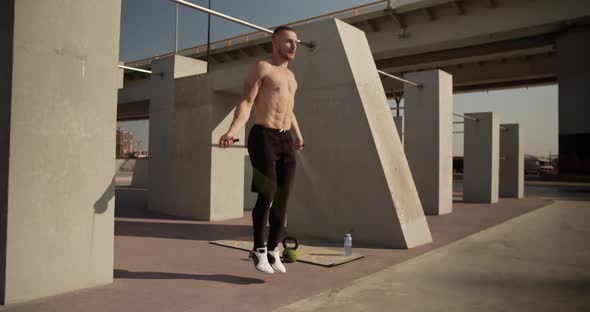 Sportsman Exercising with Jumping Rope