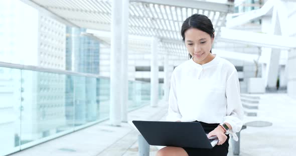 Businesswoman work on computer at outdoor