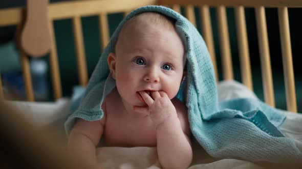 Baby Toddler Laying on the Blue Blanket Smiling and Suck your Fingers