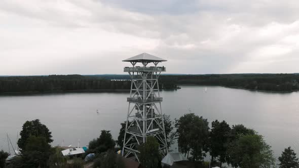 Aerial shot of Wdzydzki Park Krajobrazowy in Kaszuby, Poland with view of observation tower in Wdzyd