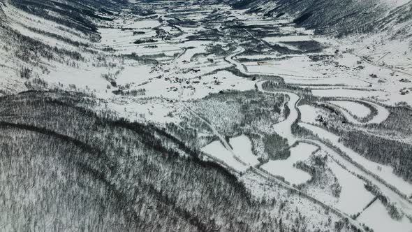 Frozen Landscape In Valleys And Forests Near Countryside Of Manndalen In Northern Norway. Aerial Dro