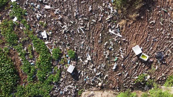 Aerial descending look down rubbish plastic pollution