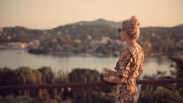 Woman Drinking White Wine Holidays Vacation. Romantic Evening Enjoying Wineglass. Celebrating.