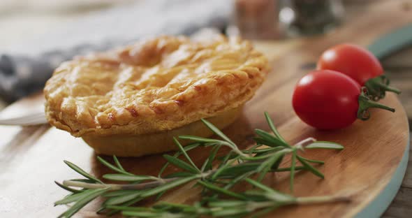 Video of pie seen from above on wooden background